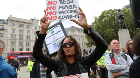 a group of people holding a sign