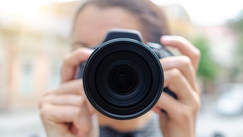 a person holding a camera