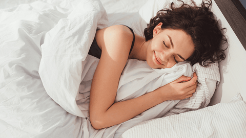 a woman lying on a bed