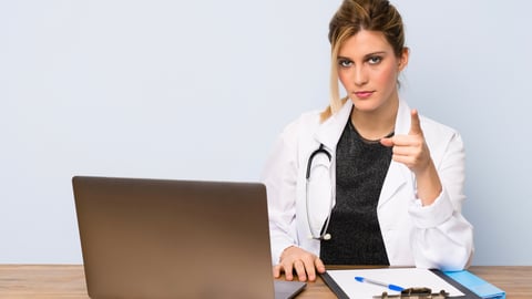 a person standing in front of a computer