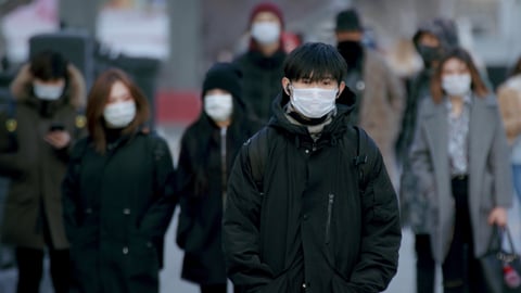 a group of people standing in front of a crowd
