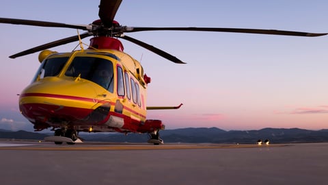 a helicopter parked on the side of a road