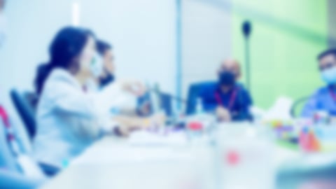 a group of people sitting at a table