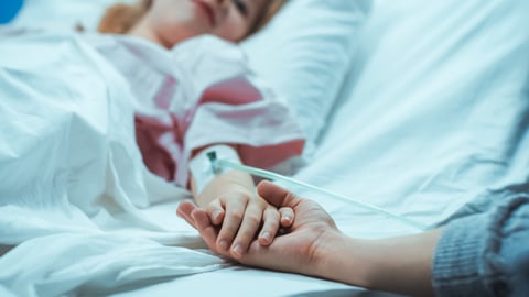 a person lying on a bed