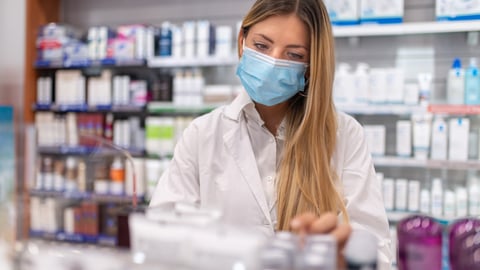 a woman standing in front of a store