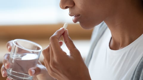 a person drinking from a cup