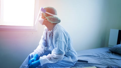 a person sitting on a bed