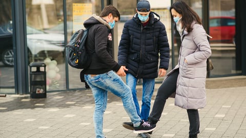 a man and a woman standing on a sidewalk
