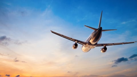 a large commercial airplane flying in the sky