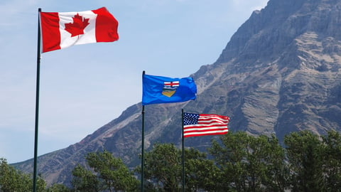 a flag flying on top of a mountain