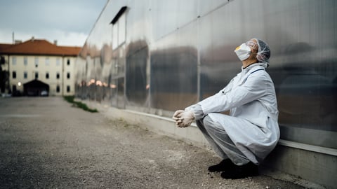 a man standing in front of a building