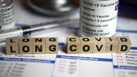 blocks reading Long COVID amongst vaccine vials