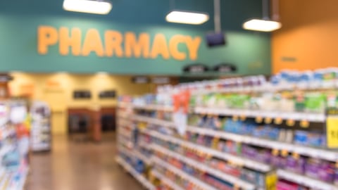 aisle of a pharmacy showing products on the shelves