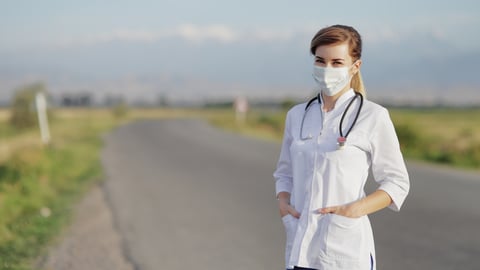 a person standing next to a road