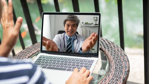 a young boy using a laptop computer