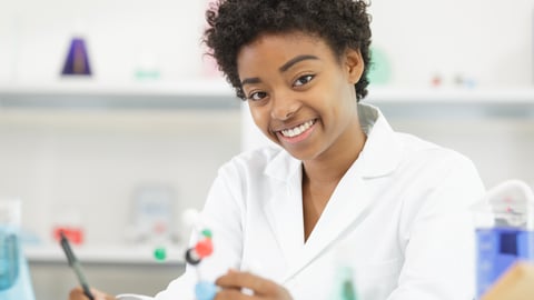 a woman who is smiling and looking at the camera