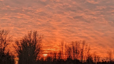 Sunset over a snowy trail