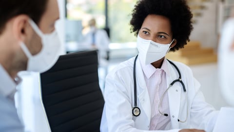 Black woman doctor consulting with a colleague