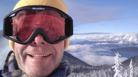 Picture of the author with ski goggles outside in the snow