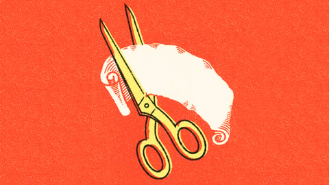 Scissors cutting a piece of paper