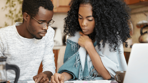 Father and daughter with calculator smaller