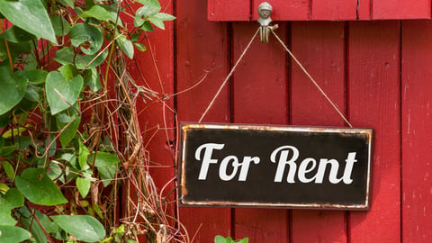 red-cottage-for-rent-sign