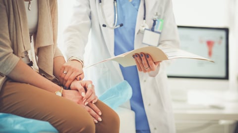 doctor holding hand of patient