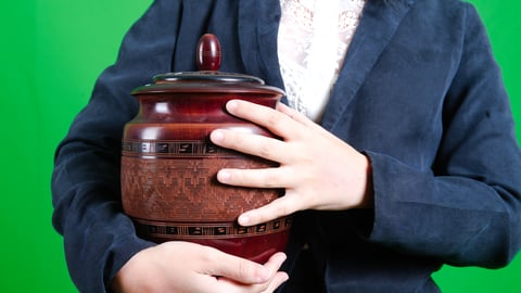 woman-holding-cremation-urn