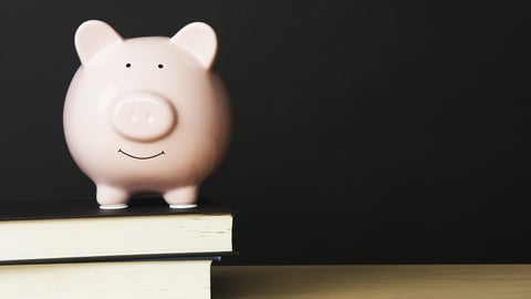 Piggy bank on a stack of books