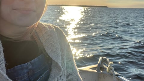 Amy Lamb in a boat