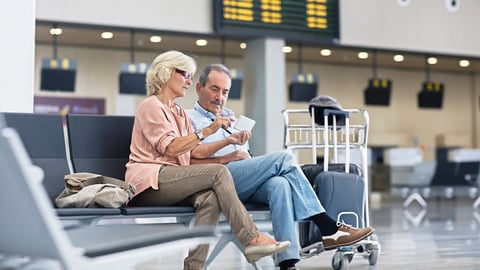 Older couple sitting in an airport