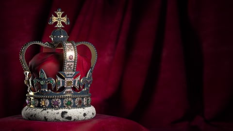 The crown on a red velvet pillow