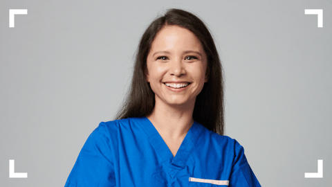 Woman smiling wearing scrubs