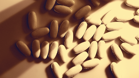 pills spilling out of bottle