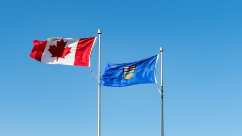 Canadian and Alberta flags flying side by side