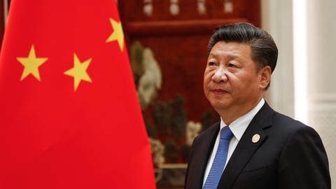 Xi Jinping wearing a suit and tie