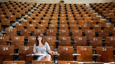 woman-in-classroom-empty-seats