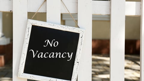 Black-sign-with-no-vacancy-written-on-it