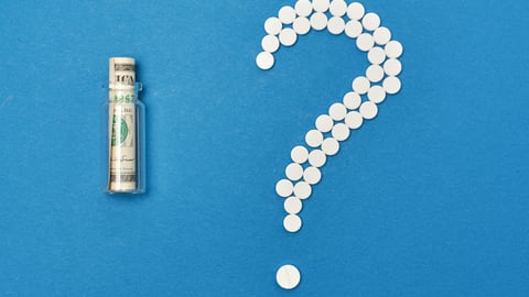 money-in-vial-beside-pills-question-mark