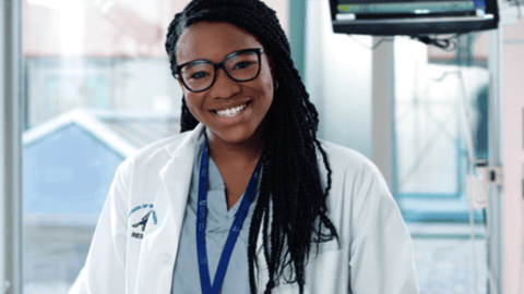 Young Black doctor smiling