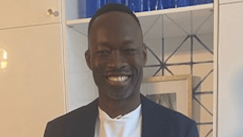 Young Black man in a blue suit