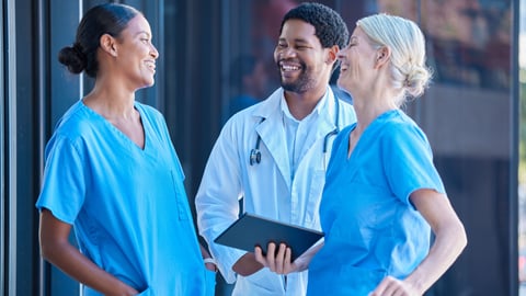 Group of healthcare workers laughing together