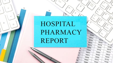 keyboad and papers with a note reading Hospital pharmacy report