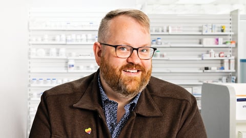 Affable man with glasses and beard smiling