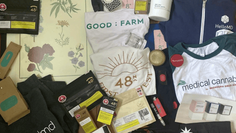 Pile of merchandise relating to various cannabis companies