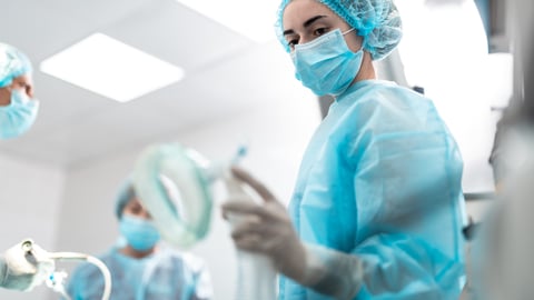 Group of young surgeons operating