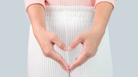 Woman holding her hands in front of her lap