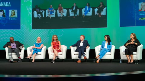 Group of people sitting on a stage