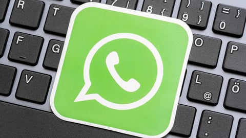 WhatsApp-green-logo-against-computer-keyboard