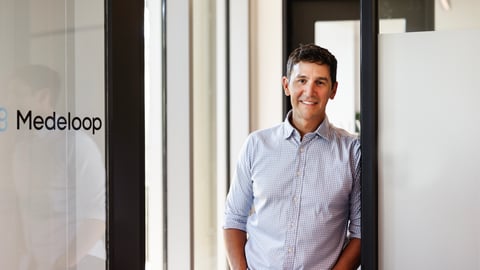 man-dark-hair-dress-shirt-standing